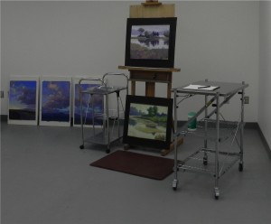 Easel and carts with Taos and Sepowet paintings