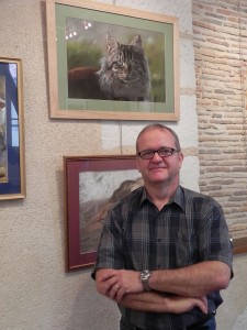Philippe Caille (aka Pastel Philippe) with his cat painting